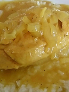 A picture of CHICKEN WITH MUSTARD SAUCE ON A BED OF WHITE RICE.