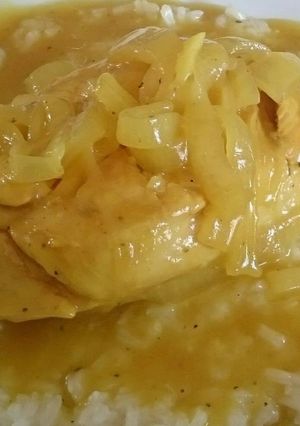 A picture of CHICKEN WITH MUSTARD SAUCE ON A BED OF WHITE RICE.