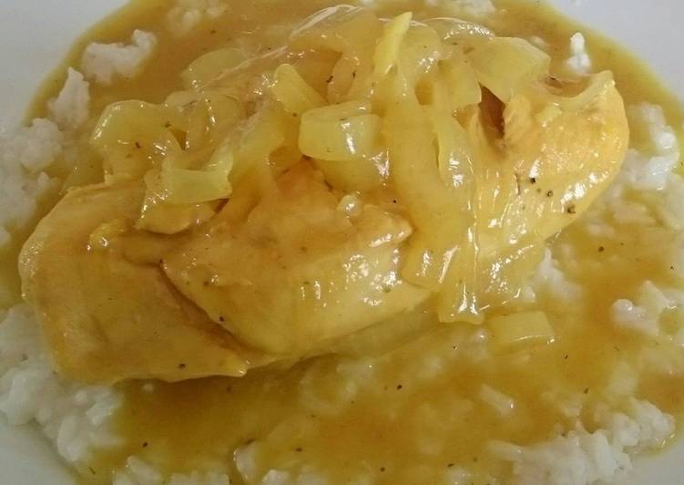 CHICKEN WITH MUSTARD SAUCE ON A BED OF WHITE RICE