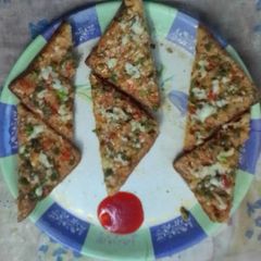 A picture of Cheesy veggie bread pizza.