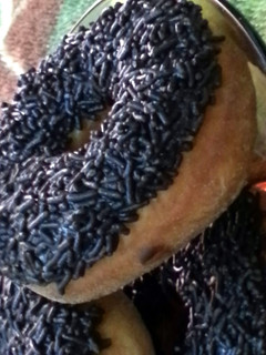 A picture of chocolate sprinkled donuts.
