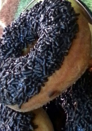 A picture of chocolate sprinkled donuts.