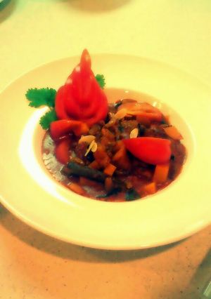 A picture of chicken kuzi wth almond & raisin.