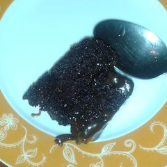 A picture of Ultra moist chocolate cake with chocolate sauce.