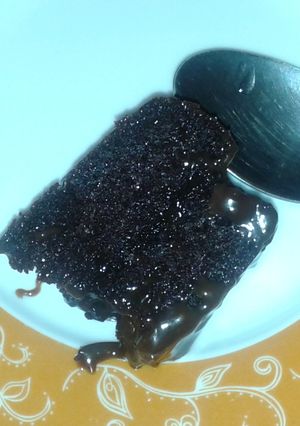 A picture of Ultra moist chocolate cake with chocolate sauce.