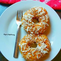 A picture of Fresh coconut coated doughuts.