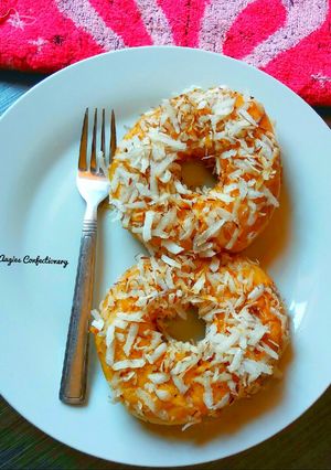 A picture of Fresh coconut coated doughuts.