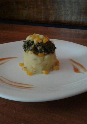 A picture of Mashed Potatoes Topped with Sautee Spinach(Sweet corns).