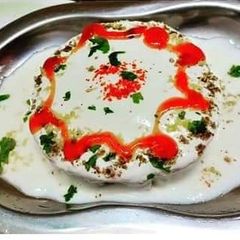 A picture of Aloo bread masala dahi vada chat.