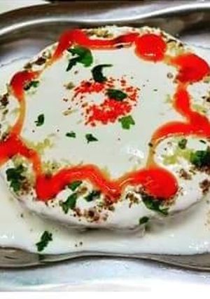 A picture of Aloo bread masala dahi vada chat.