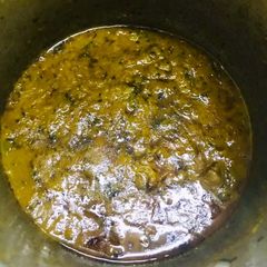 A picture of Tomato mutton curry.