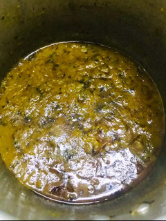 A picture of Tomato mutton curry.