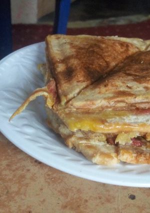 A picture of Bread toasted with Egg, Sausage, and Sardine.
