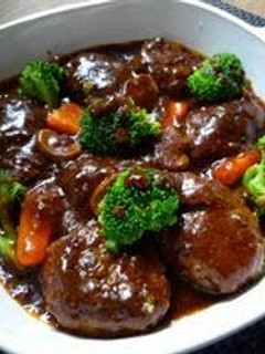 A picture of Delicious Hamburgers Simmered In Demi-glace Sauce.