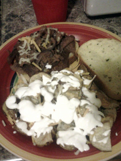 A picture of Steak melts on garlic toast.