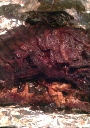 A picture of Stuffed Tri-Tip wrapped in Bacon.
