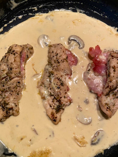 A picture of Italian chicken,bacon and mushroom sauce.