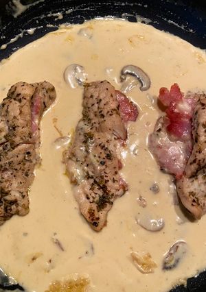 A picture of Italian chicken,bacon and mushroom sauce.