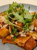 Ravioli and pumpkin in tomato sauce