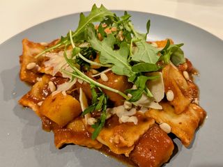 Ravioli and pumpkin in tomato sauce