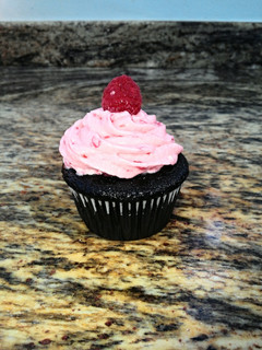 A picture of Sinfully Chocolate Cupcakes with Raspberry Buttercream Icing.