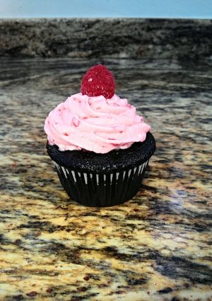 A picture of Sinfully Chocolate Cupcakes with Raspberry Buttercream Icing.