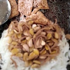 A picture of fried tofu with vinegar and soy sauce dip.