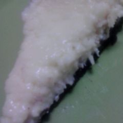 A picture of White chocolate cheesecake w/ chocolate crust.
