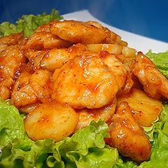 A picture of Chicken Breast and Potatoes with Chili Sauce.
