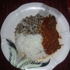 A picture of Rice & beans with stew.