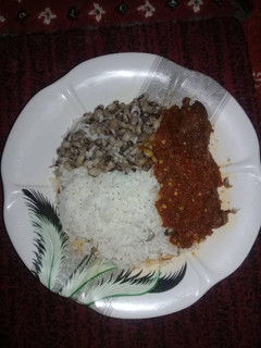 A picture of Rice & beans with stew.