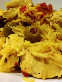 A picture of Spanish rice with chicken.