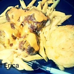 A picture of Penne and meatballs.