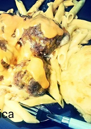 A picture of Penne and meatballs.