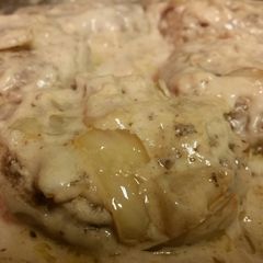 A picture of Smothered cream of mushroom Hamburger steak.