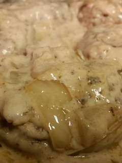 A picture of Smothered cream of mushroom Hamburger steak.