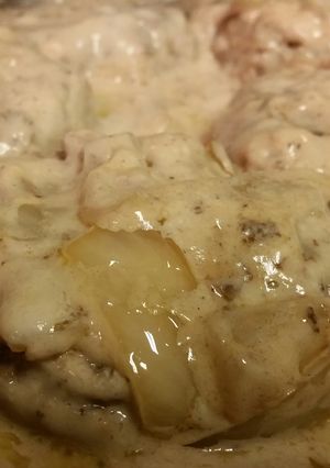 A picture of Smothered cream of mushroom Hamburger steak.