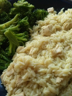 A picture of Chicken and Rice with Broccoli.