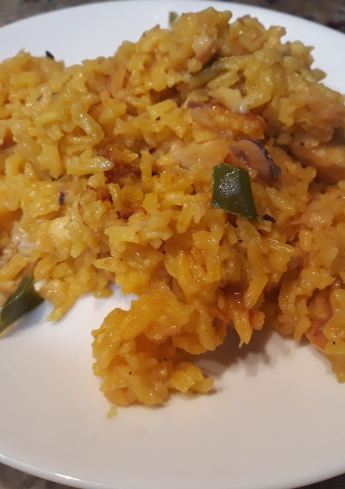 Una foto de Arroz con merluza calamar y gambón