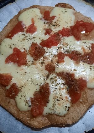 Una foto de Pizza de harina integral