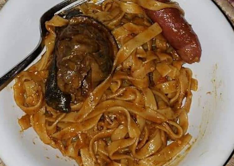 Pasta with sausage and fried fish