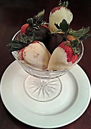 A picture of White and Dark Chocolate Covered Strawberries.