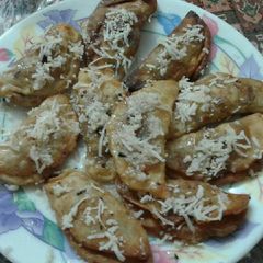 A picture of Nariel Chandrapulis (typical Bengals cuisine).