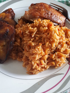 A picture of Jollof rice and fried chicken.