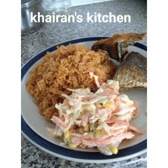 A picture of Jollof rice and coleslaw.