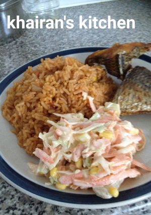 A picture of Jollof rice and coleslaw.