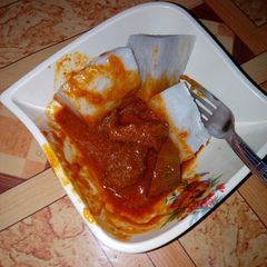 A picture of White yam and stew with meat.