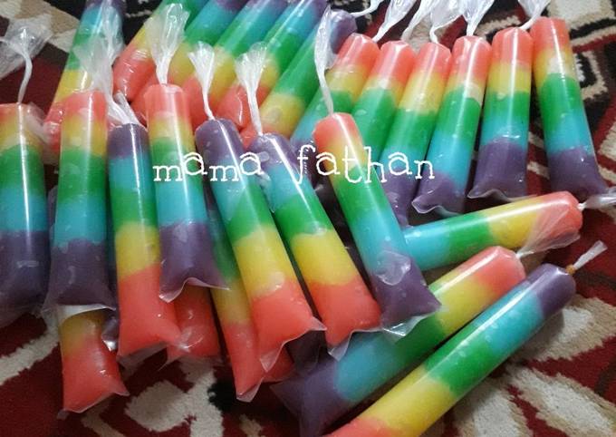 Resep Es lilin rainbow nutrijell oleh Mama fathan Cookpad