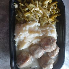 A picture of Swedish Meatballs w/ Cheesy Green Beans and Mashed Potatoes.