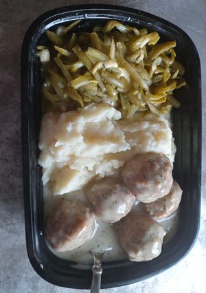 A picture of Swedish Meatballs w/ Cheesy Green Beans and Mashed Potatoes.